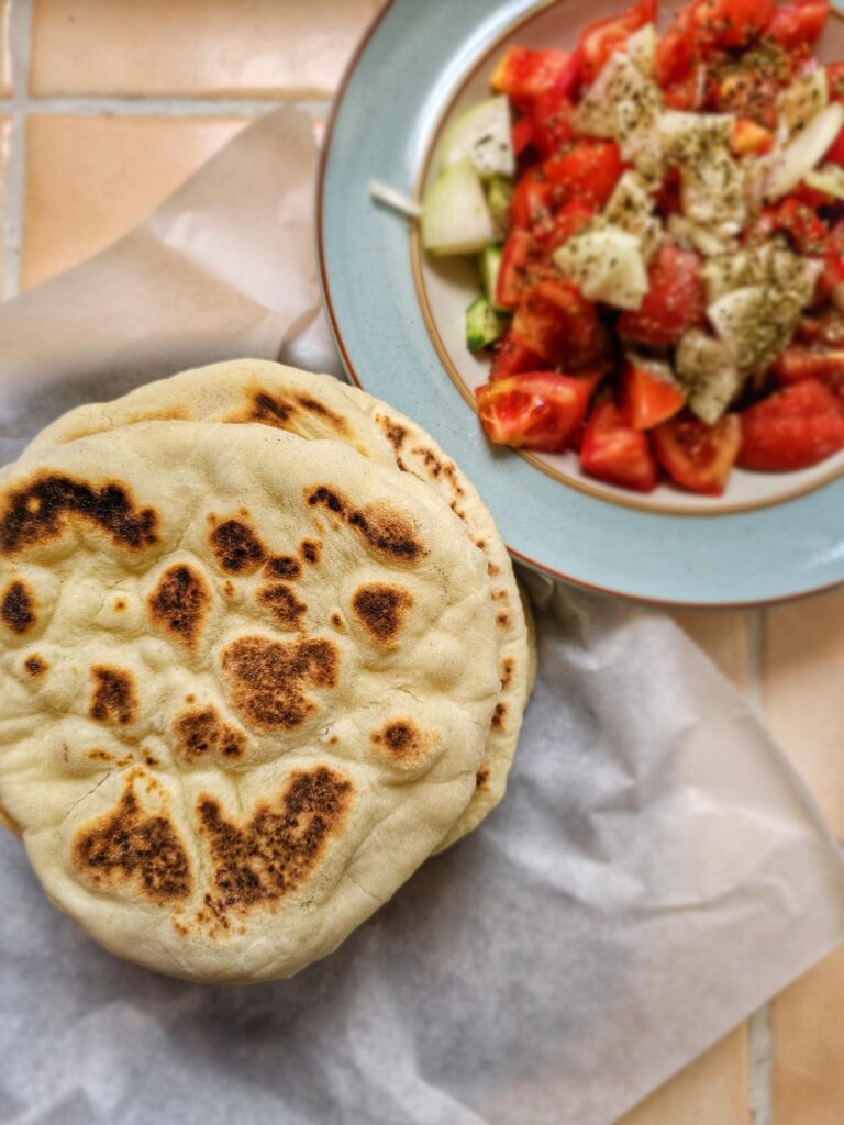 greek pita bread with a side of greek salad